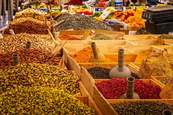 Spices, nuts and dried fruit at a market - colorful