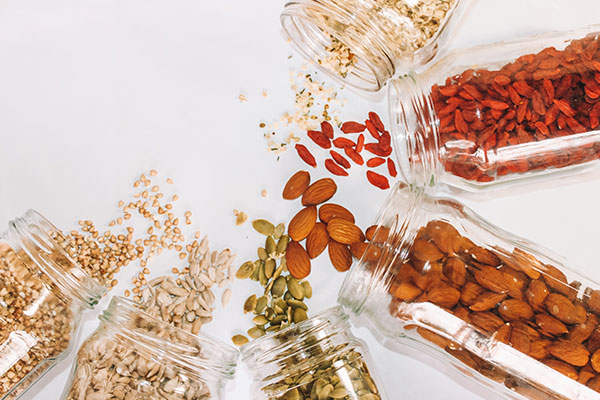 Seeds, nuts and dried fruit in containers